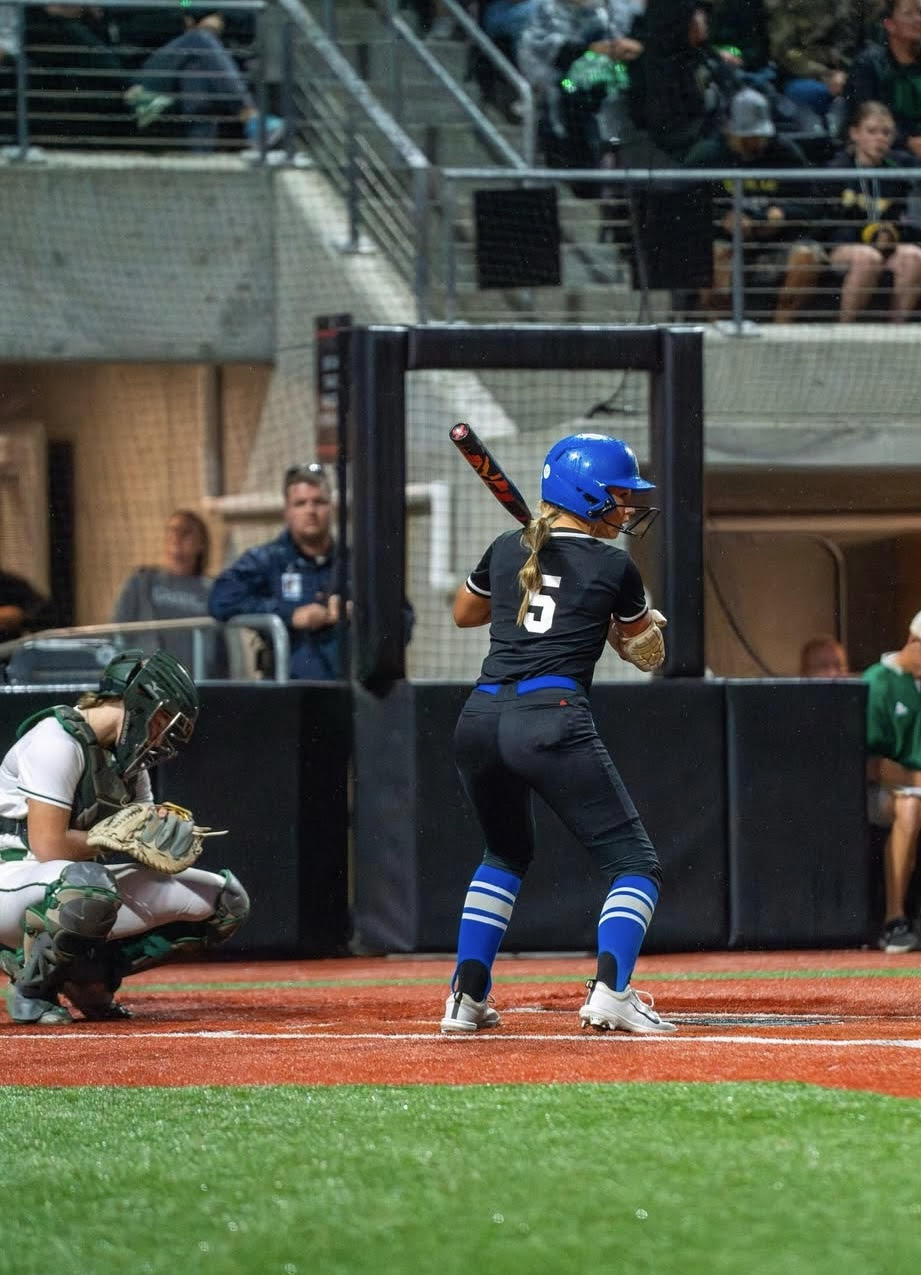 Sophomore Abby Beard steps up to bat, taking practice swings before running to first base. Her and the team gear up for at the State Championships against Gretna.
