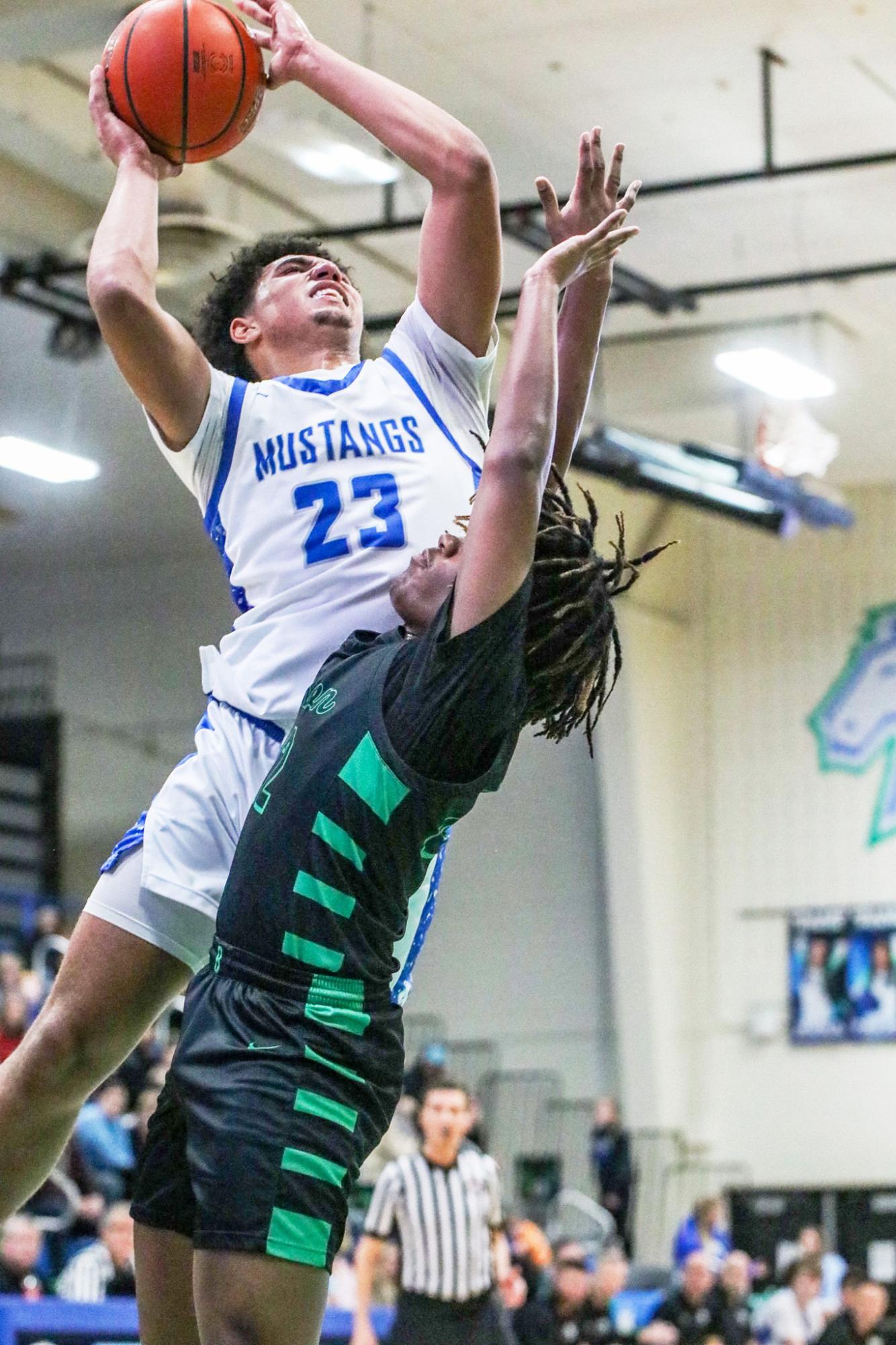 Derek Rollins rises up against Millard West High School. Rollins dropped 30 points and eleven rebounds during the game. 